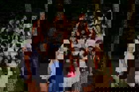 Group of people celebrating on stage