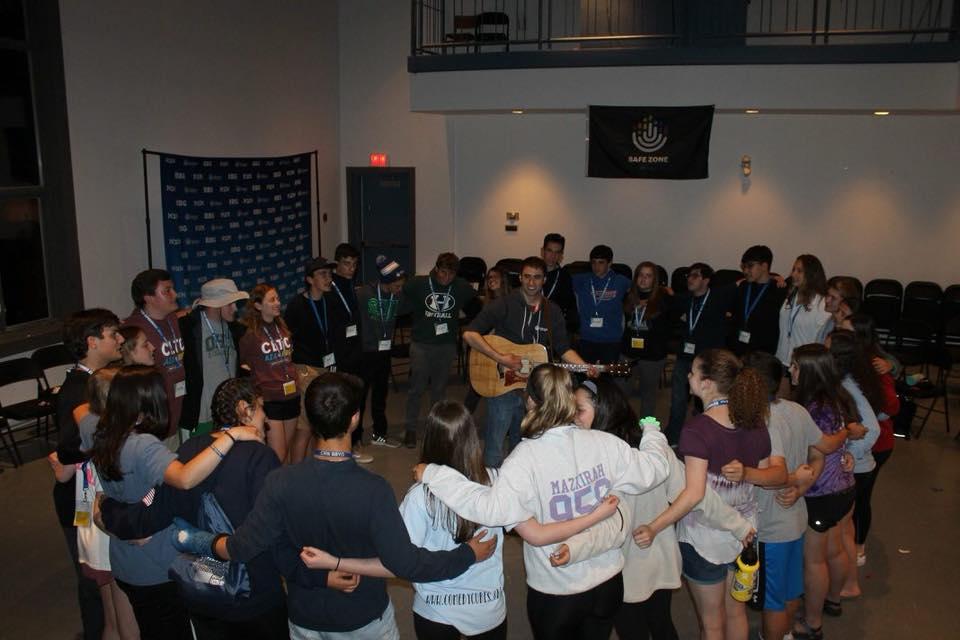 Group of people celebrating on stage