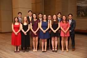 Group of people celebrating on stage