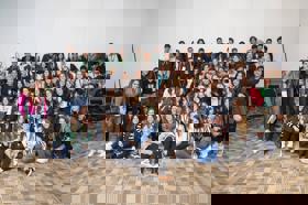 Group of people celebrating on stage