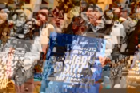 Group of people celebrating on stage