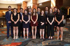 Group of people celebrating on stage