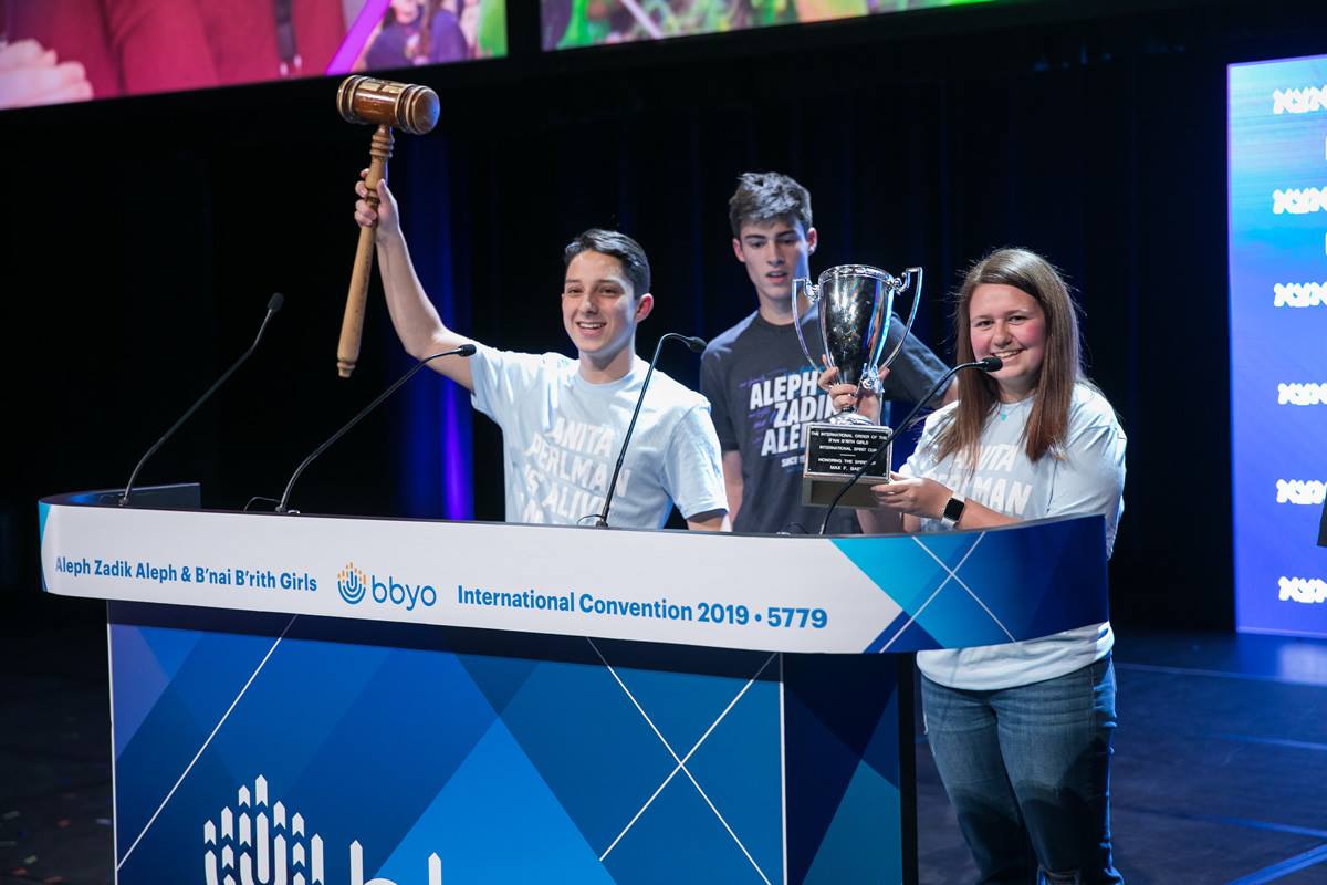 Group of people celebrating on stage