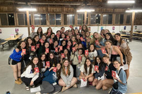 Group of people celebrating on stage