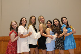 Group of people celebrating on stage