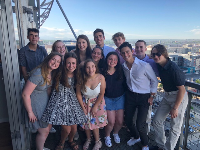 Group of people celebrating on stage