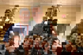 Group of people celebrating on stage