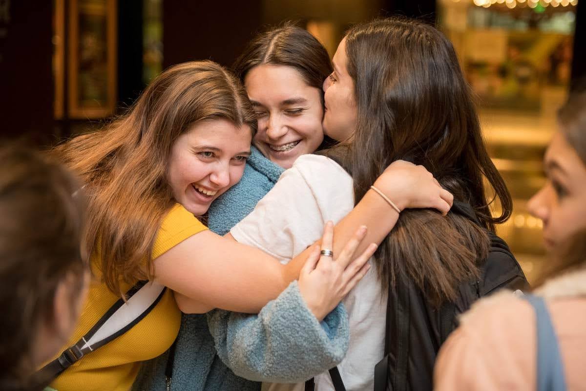 Group of people celebrating on stage