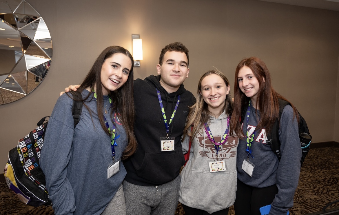 Group of people celebrating on stage