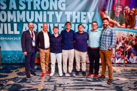 Group of people celebrating on stage
