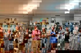 Group of people celebrating on stage