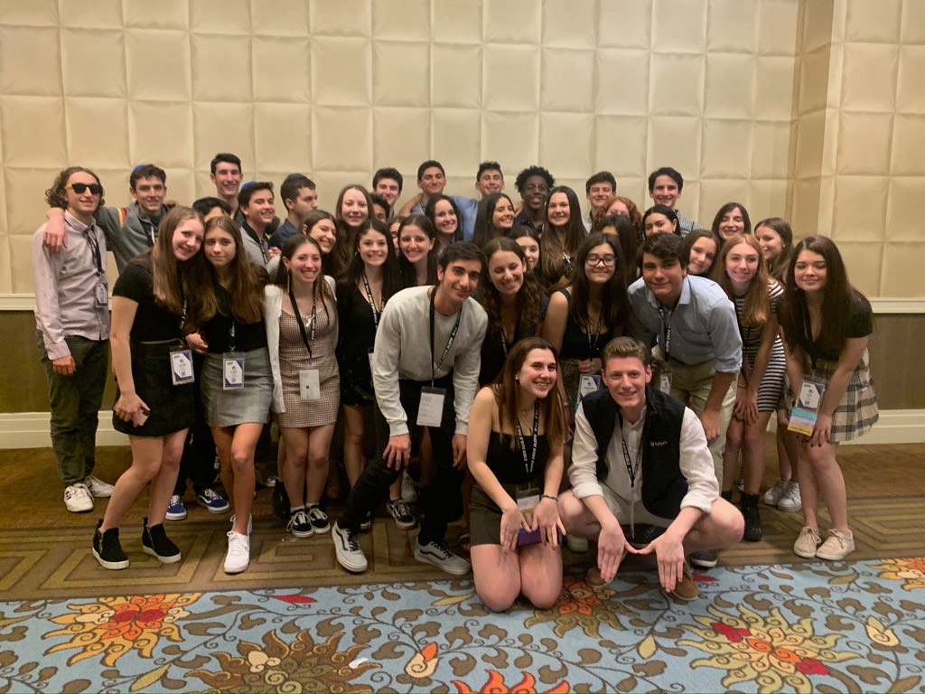 Group of people celebrating on stage
