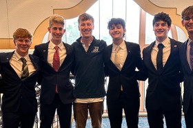 Group of people celebrating on stage