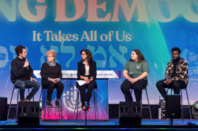 Group of people celebrating on stage
