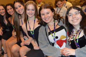 Group of people celebrating on stage