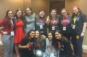 Group of people celebrating on stage