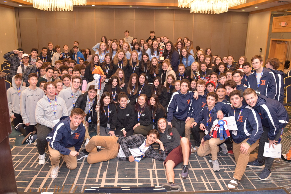 Group of people celebrating on stage