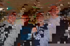 Group of people celebrating on stage