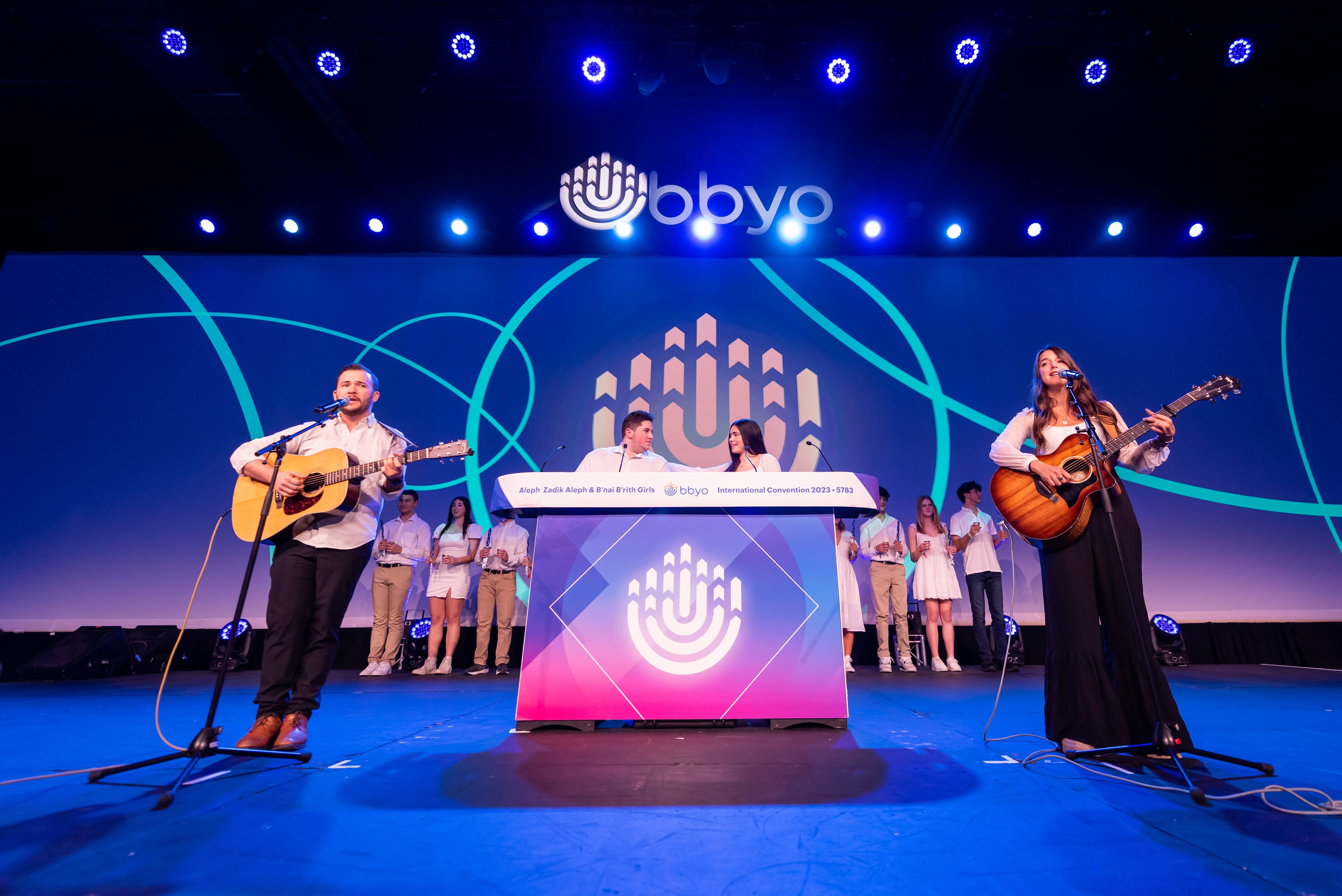 Group of people celebrating on stage