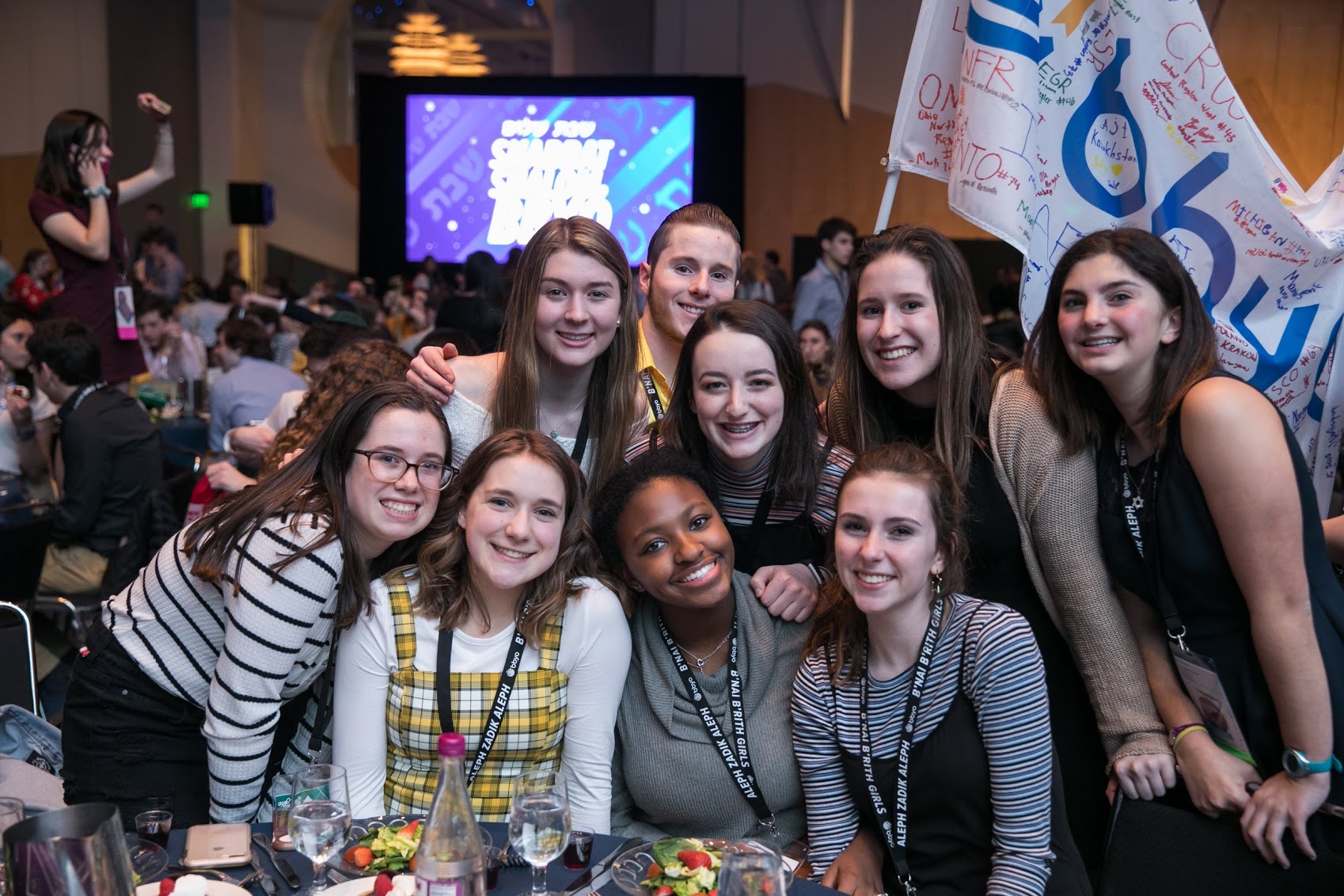 Group of people celebrating on stage