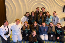 Group of people celebrating on stage