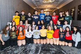 Group of people celebrating on stage