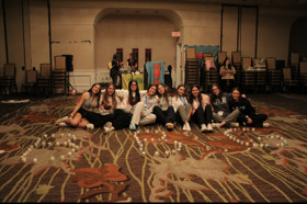 Group of people celebrating on stage