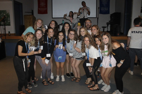 Group of people celebrating on stage