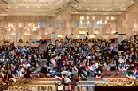 Group of people celebrating on stage