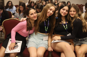 Group of people celebrating on stage