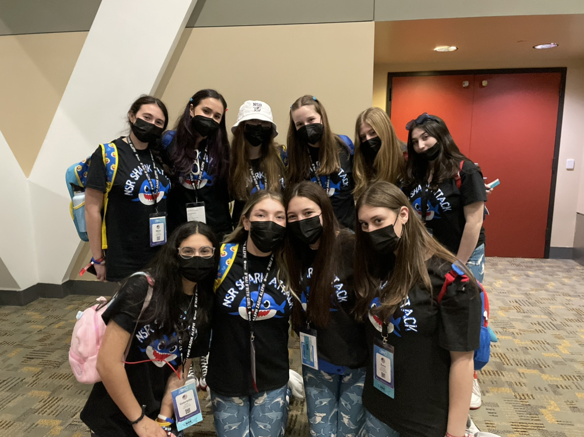 Group of people celebrating on stage