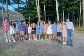 Group of people celebrating on stage