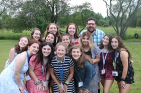 Group of people celebrating on stage